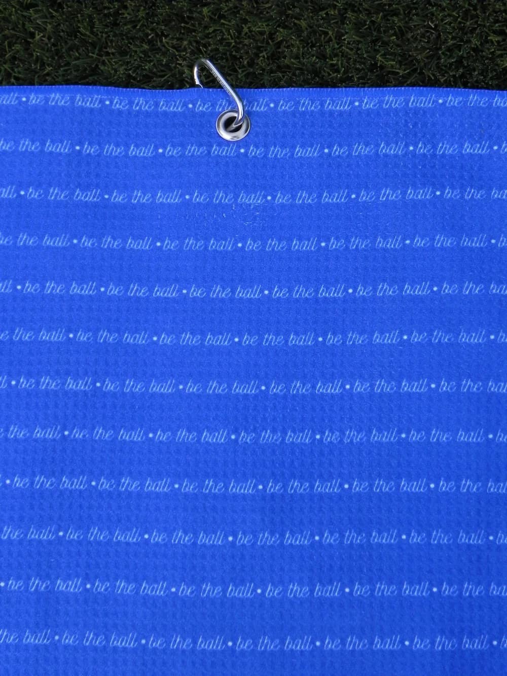 Be The Ball golf towel – front view showing microfiber texture and printed design.