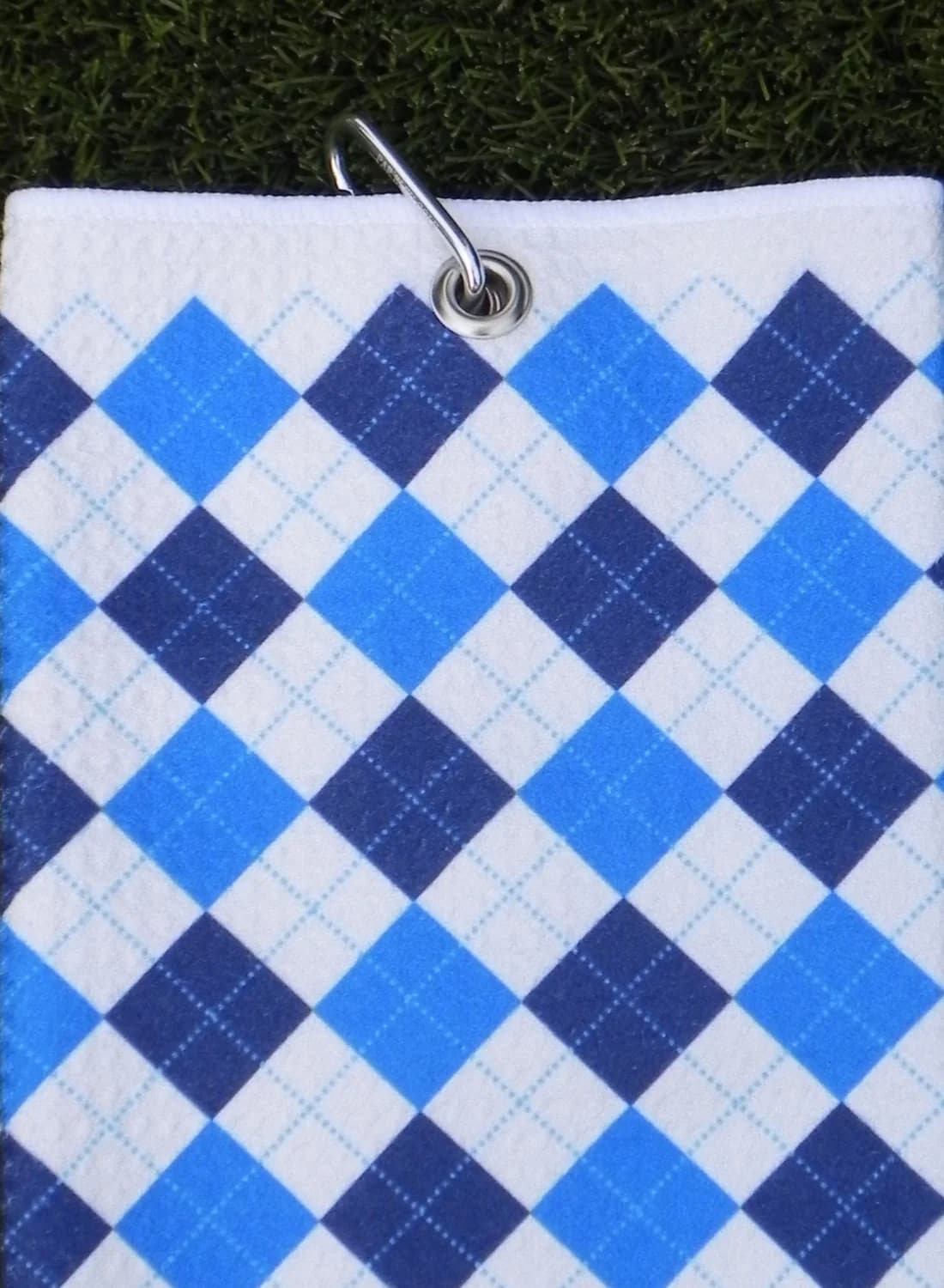 Blue and navy plaid golf towel with carabiner clip for easy attachment to golf bag