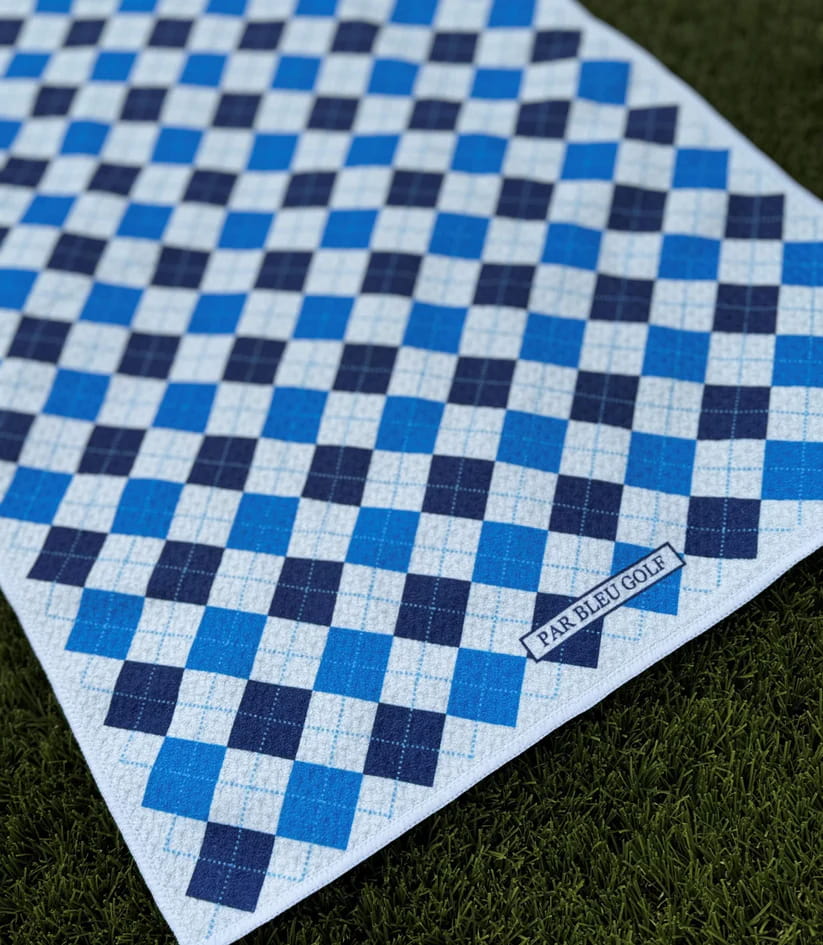 Close-up of The Argyle Chipper: Blue & Bleu towel with Par Bleu logo and diamond check pattern