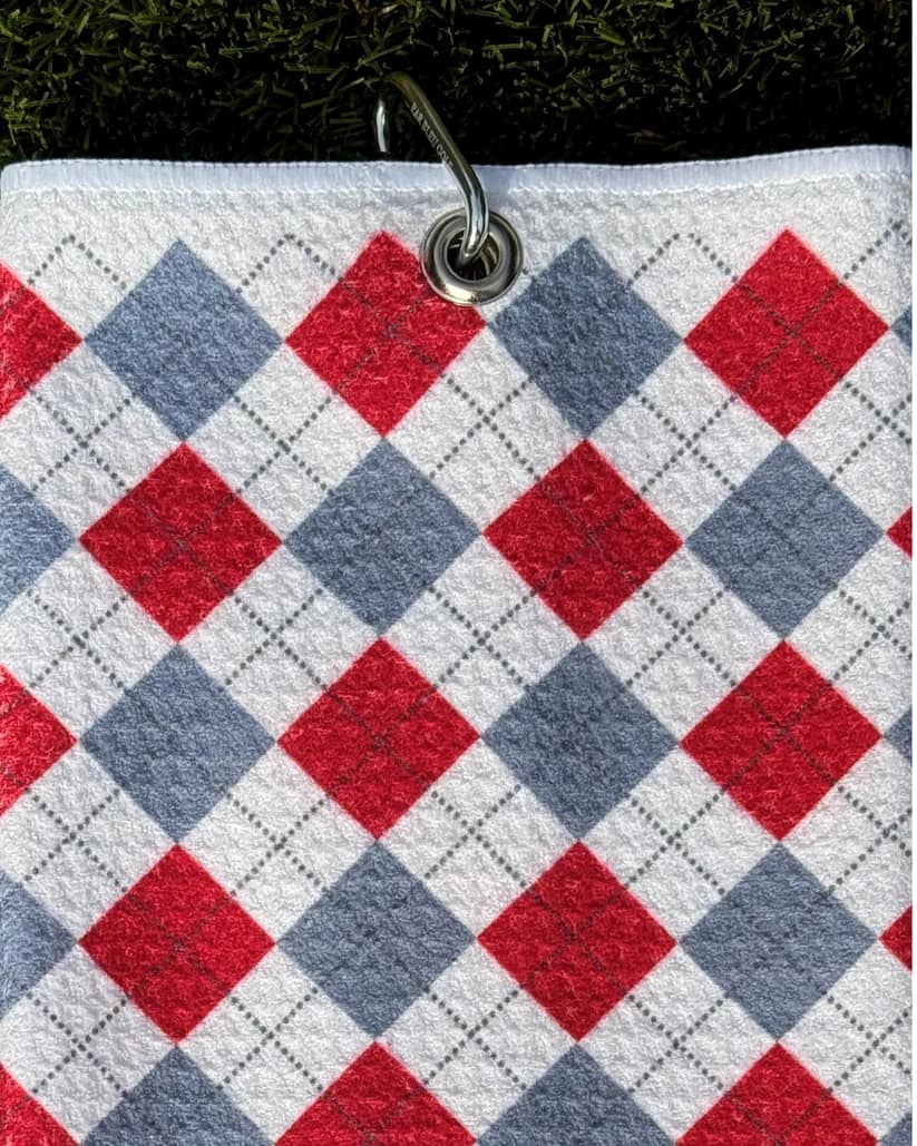 Cardinal and grey plaid golf towel hanging by metal carabiner clip with diamond print detail