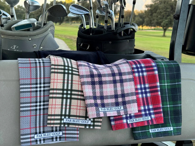 Burr Plaid golf towel displayed in golf cart next to other colorful Par Bleu towels