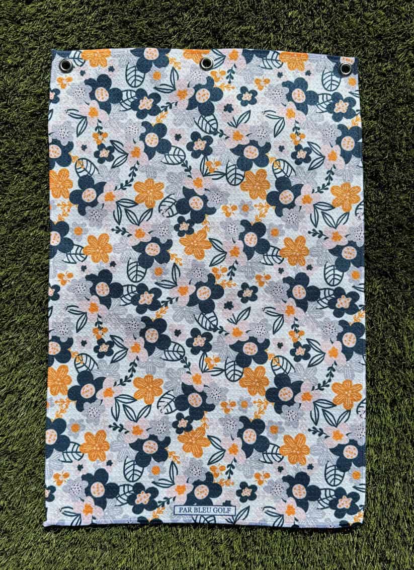 The Floral in Greys microfiber towel laid flat, showing elegant grey and yellow flower design for women