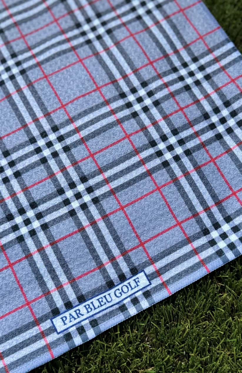 Close-up of The Grey Plaid microfiber golf towel showing Par Bleu logo and classic plaid design