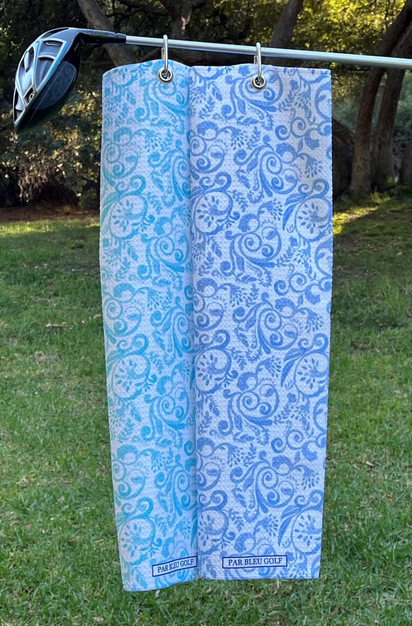 Blue and Teal golf towels hanging outdoors, premium golf accessories for women