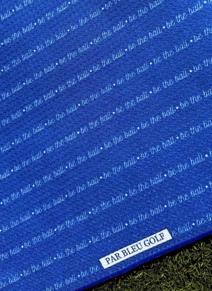 Close-up of Be The Ball golf towel – durable stitching and bold print