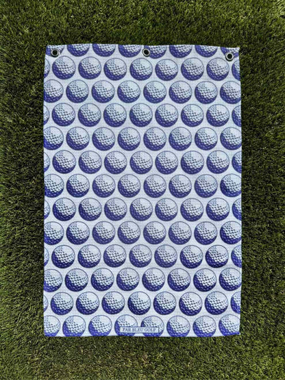 Blue towel laid fully flat on grass, clearly showing its pattern and proportions—ideal for shoppers seeking full design view.