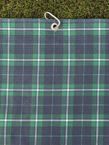 Microfiber golf towel in dark green and blue plaid pattern, hanging with metal carabiner
