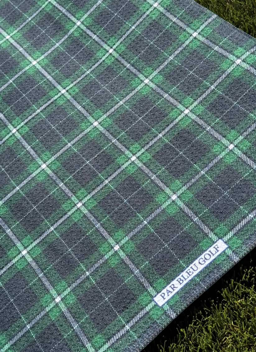 Close-up of emerald and navy plaid microfiber golf towel with Par Bleu Golf logo