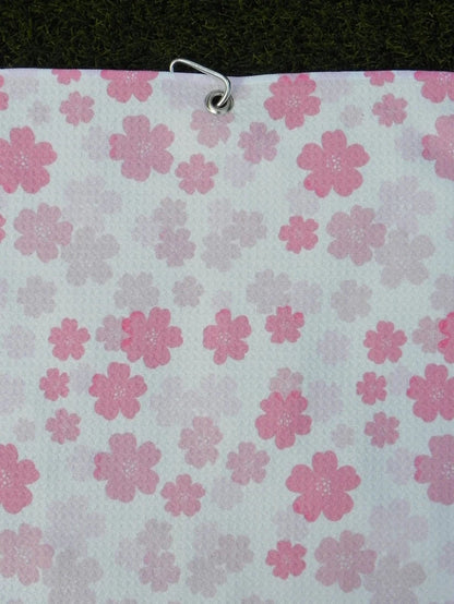 Women’s microfiber golf towel in light pink floral pattern, with secure metal carabiner