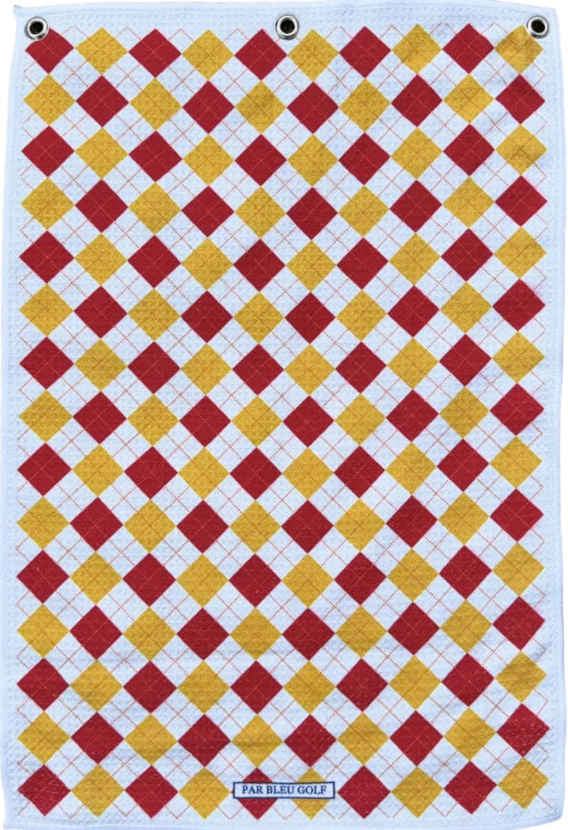 Full view of red and gold argyle golf towel with classic diamond pattern on white background