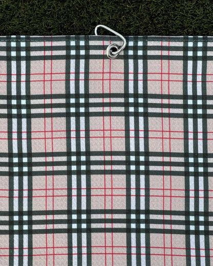 Burr Plaid golf towel hanging vertically with attached carabiner clip