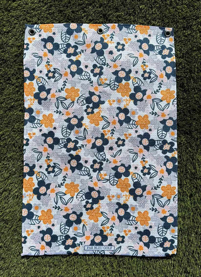 The Floral in Greys microfiber towel laid flat, showing elegant grey and yellow flower design for women