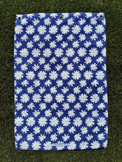 The Navy Daisy golf towel laid flat showing feminine floral design on soft navy microfiber