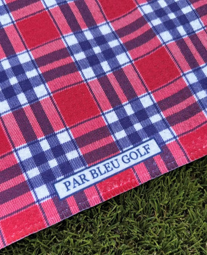 Close-up of The Red Plaid microfiber golf towel showing Par Bleu logo and bold checkered pattern