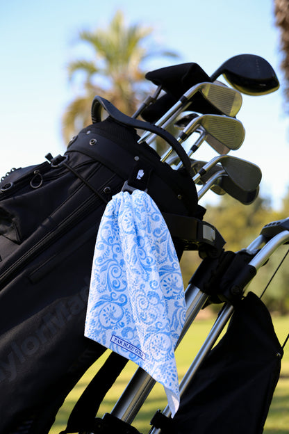 Blue floral golf towel clipped to golf bag, perfect golf gift for stylish players